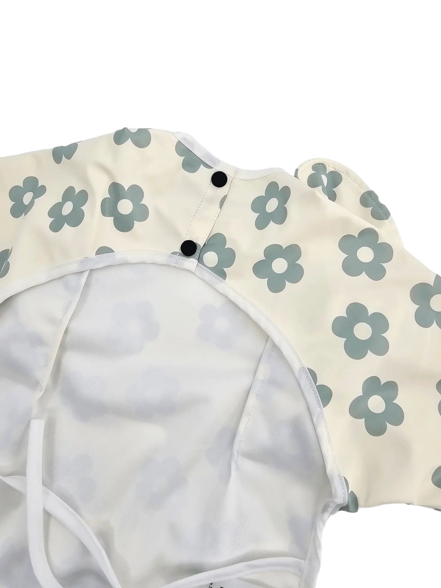 Cream and Sage Daisy Print Frill Detailed Waterproof Bib with Sleeves - Betty Brown Boutique Ltd