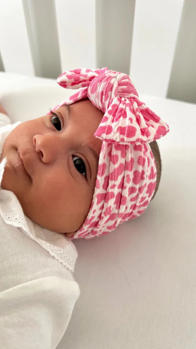 Pink Cow Print Smaller Bow Headband For Babies From Newborn - Image 1