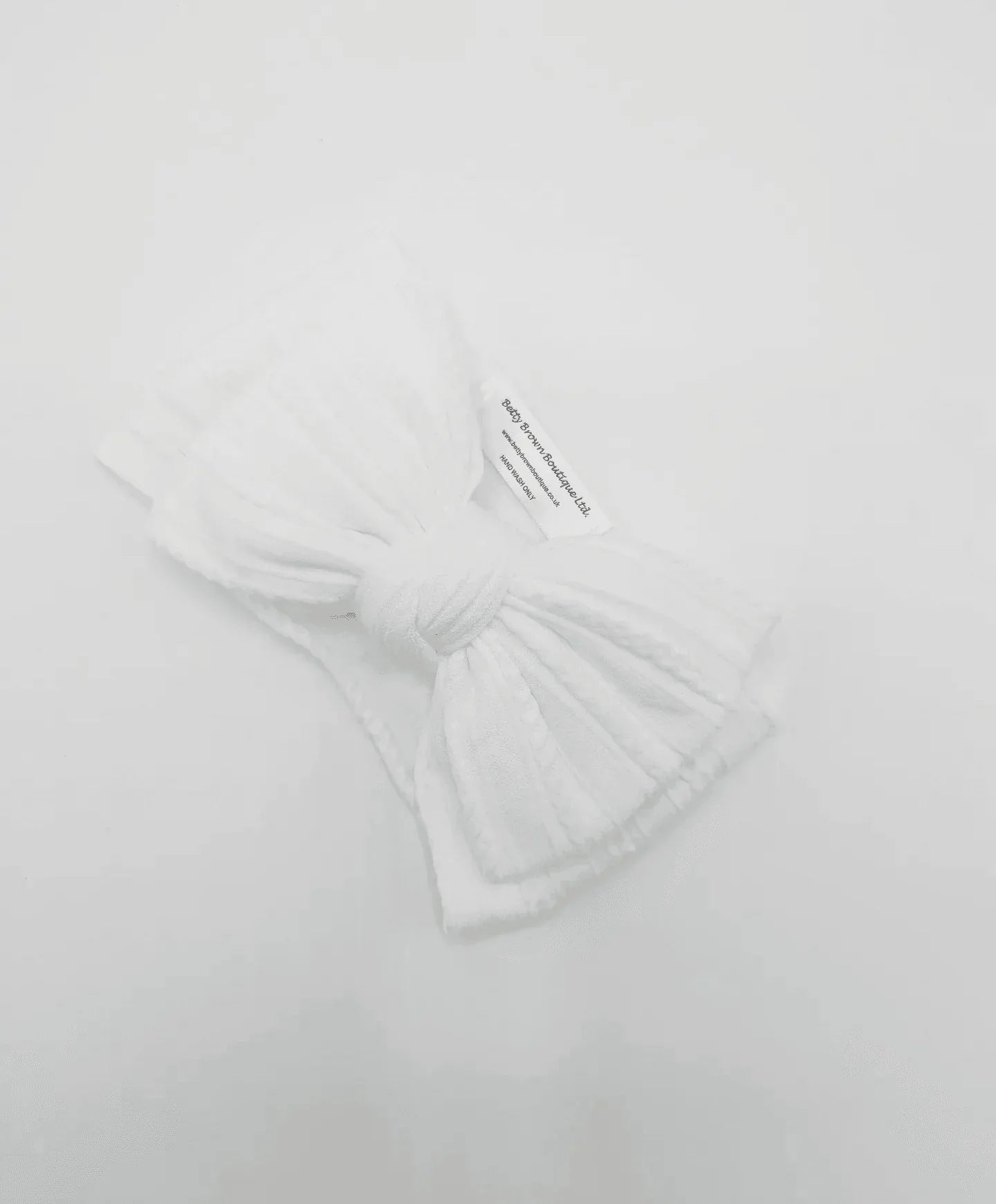 White Larger Bow Headband Designed For Newborn Babies to Age 3 - Image 6