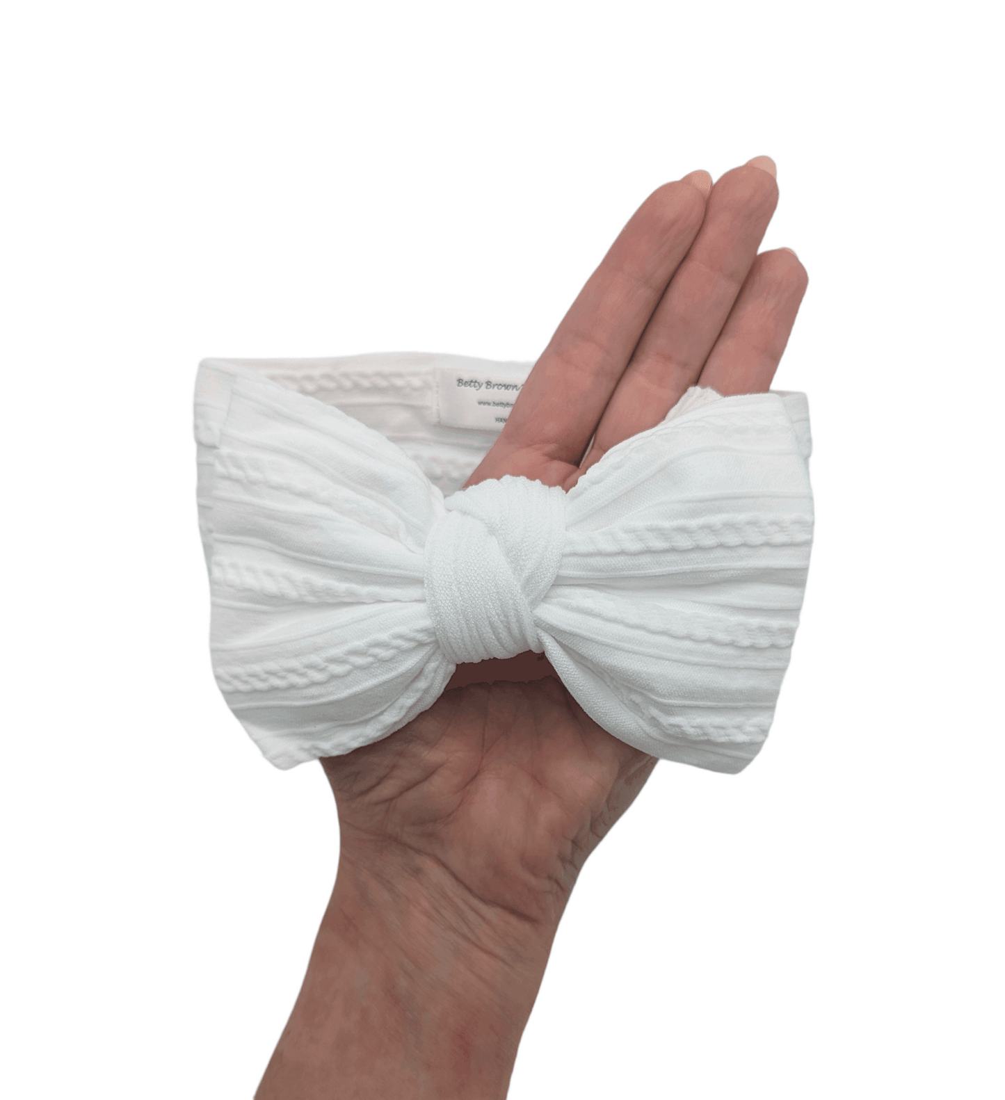 White Larger Bow Headband Designed For Newborn Babies to Age 3 - Image 3