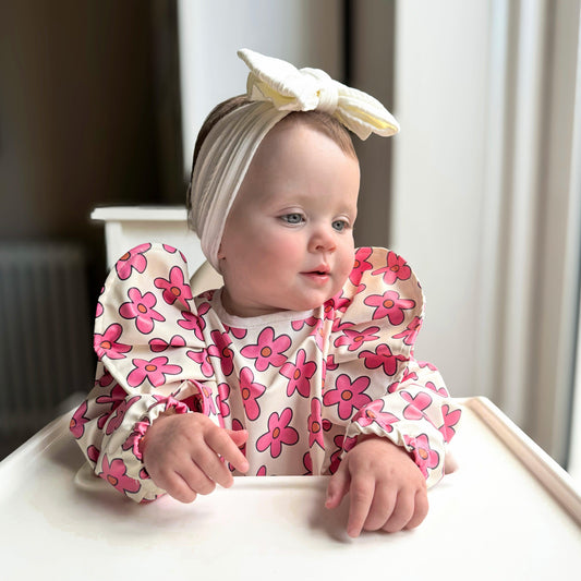 Cream and Pink Daisy Print Frill Detailed Waterproof Bib with Sleeves - Betty Brown Boutique Ltd