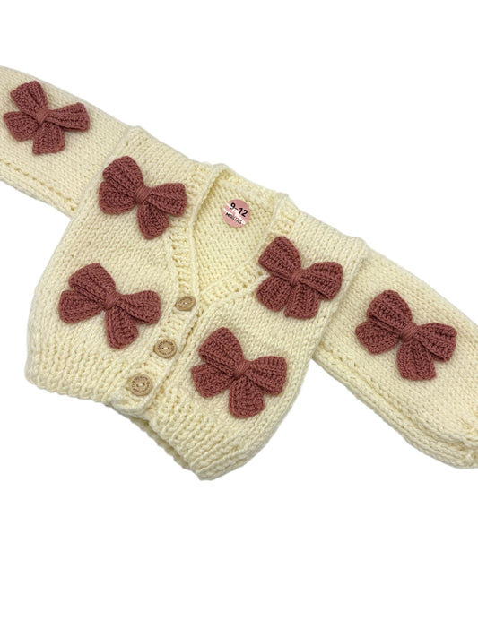 Cream and Darker Dusty Pink Handknitted Bow Patterned Cardigan