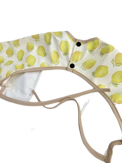 Lemon Print Frill Detail Waterproof Bib with Sleeves - Betty Brown Boutique Ltd