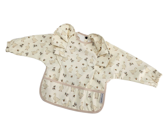 Neutral Duck Print Frill Detail Waterproof Bib with Sleeves - Betty Brown Boutique Ltd