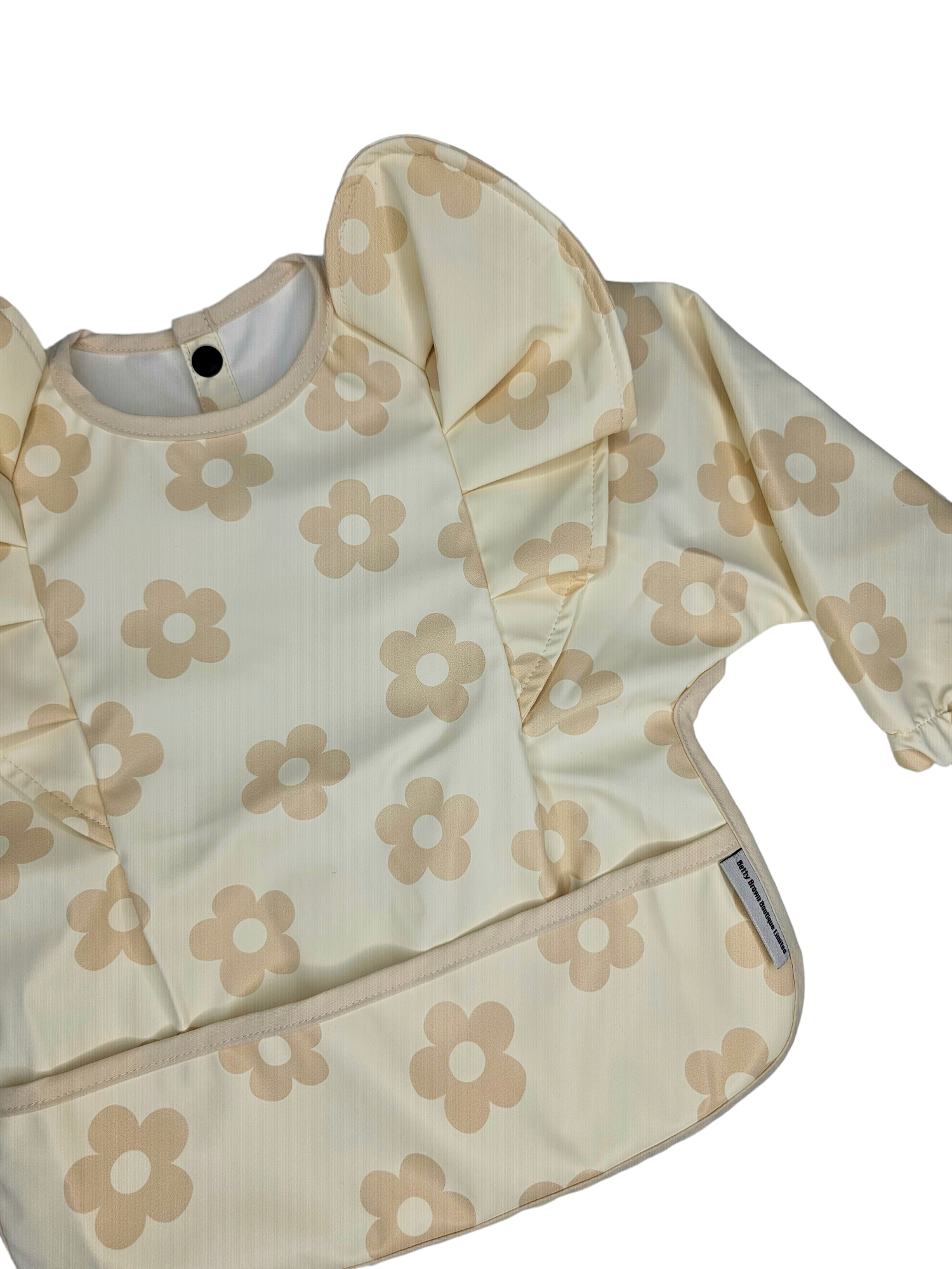 Neutral Daisy Print Frill Detail Waterproof Bib with Sleeves - Betty Brown Boutique Ltd