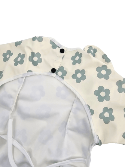 Cream and Sage Daisy Print Frill Detail Waterproof Bib with Sleeves