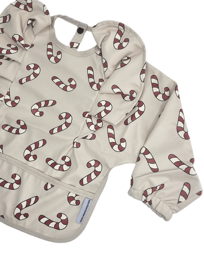 Neutral Candy Cane Christmas Print Frill Detail Waterproof Bib with Sleeves