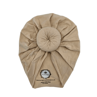 Beige Turban Hat with Donut Design For Newborn to 6 Months - Image 1
