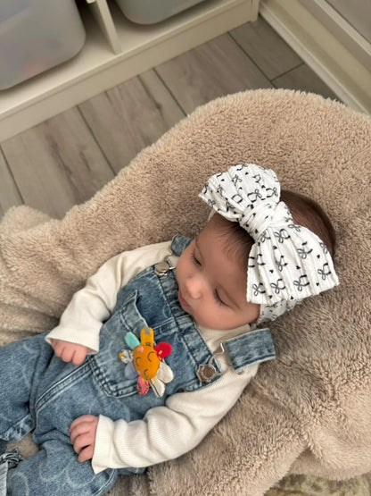 Black Bow Print Larger Bow Headband for Newborns to Age 3 - Image 1