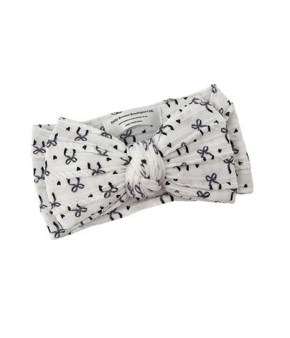 Black Bow Print Larger Bow Headband for Newborns to Age 3 - Image 2