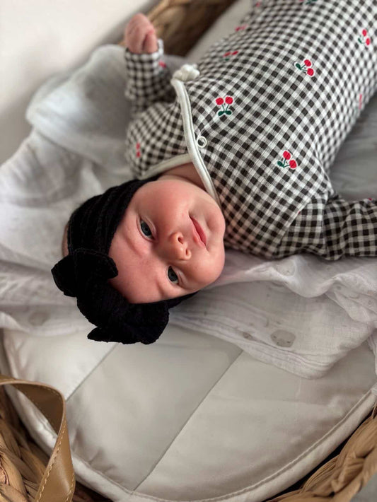 Black Smaller Bow Headband Designed For Newborns to Age 3 - Image 1