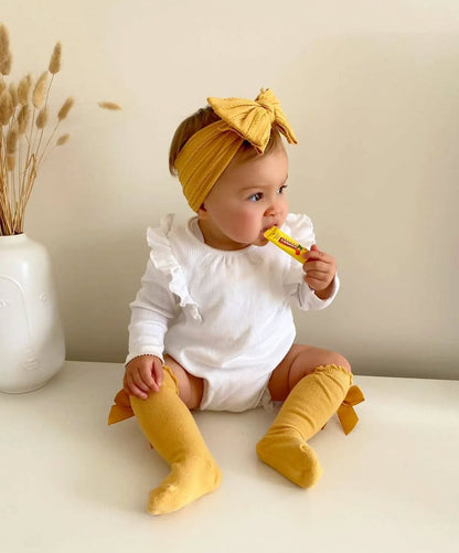 White Larger Bow Headband Designed For Newborn Babies to Age 3 - Image 3