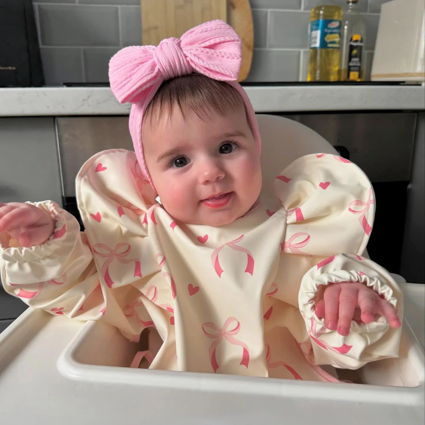 Light Pink Bow Bib with Sleeves For 6-36 Month Olds - Image 1