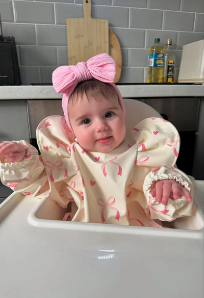 Light Pink Bow Bib with Sleeves For 6-36 Month Olds - Image 1