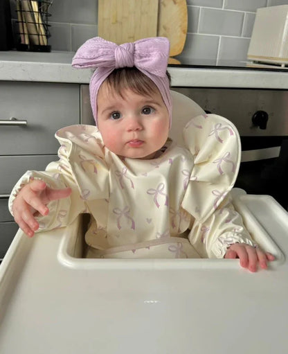 Lilac Bow Waterproof Bib with Sleeves For 6-36 Months - Image 1
