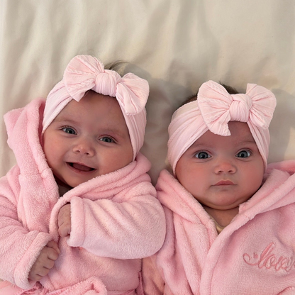 Marshmallow Pink Smaller Bow Headband For Newborns to Age 3 - Image 1
