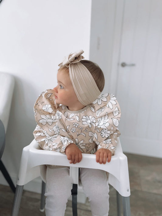 Neutral Floral Waterproof Bib with Sleeves For 6-18 Months - Image 1