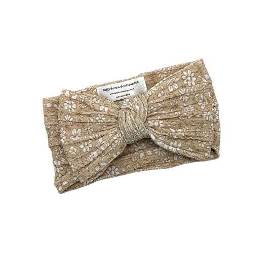 Neutral Floral Pattern Larger Bow Headband For Newborns - Image 1
