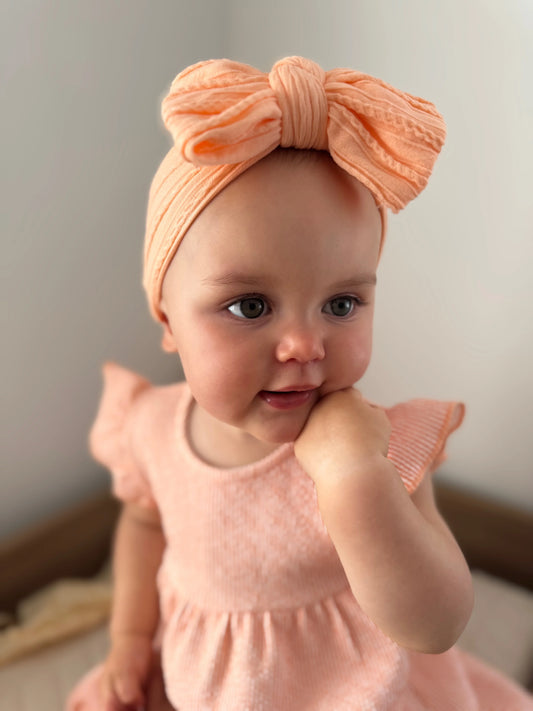 Peach Larger Bow Headband For Babies From Newborn to Age 3 - Image 1