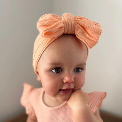 Peach Larger Bow Headband For Babies From Newborn to Age 3 - Image 1