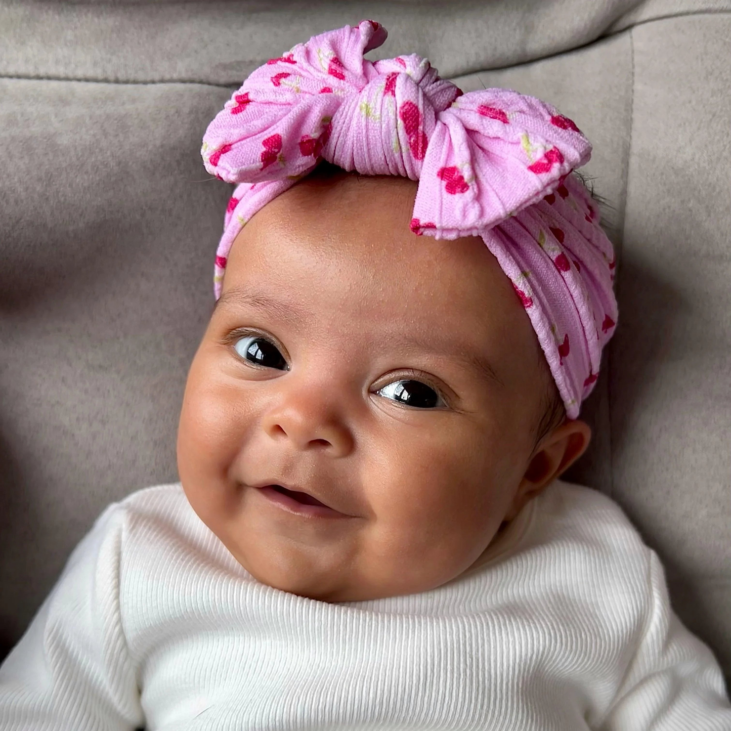 Pink Cherry Print Smaller Bow Headband For Newborns to Age 3 - Image 1