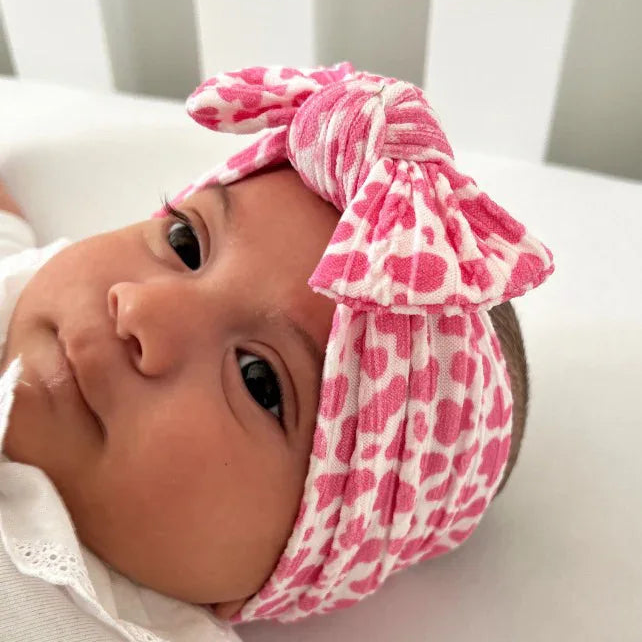 Pink Cow Print Smaller Bow Headband For Babies From Newborn - Image 1