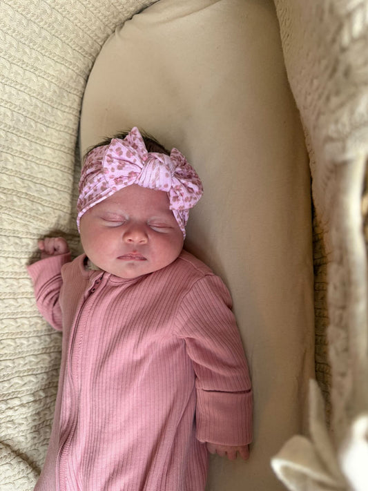 Pink Leopard Smaller Bow Headband For Newborn to Age 3 - Image 1