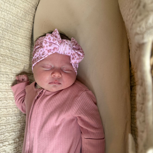 Pink Leopard Smaller Bow Headband For Newborn to Age 3 - Image 1