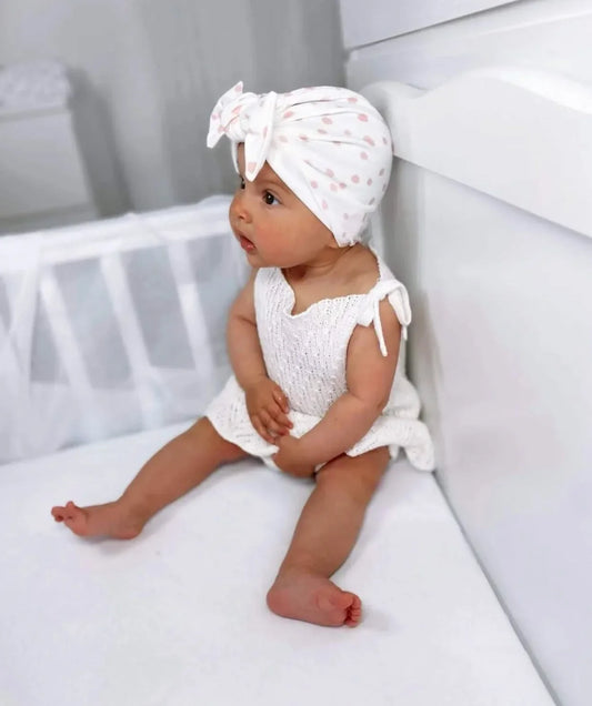Pink & White Dalmatian Turban Hat With Bow For Newborns to Age 2 - Image 1
