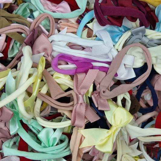 Surprise Bundle of 10 Dainty Baby Bow Headbands For Babies - Image 1