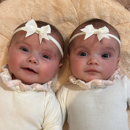 White 2 inch Baby Bow On Headband For Newborn to Age 3 - Image 1