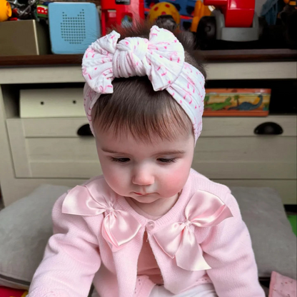 White Bow Print Smaller Bow Headband for Newborns to Age 3  - Image 1