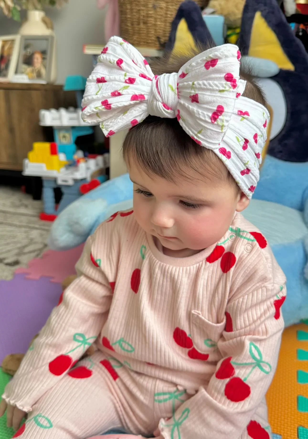 White Cherry Print Larger Bow Headband For Newborns to Age 3 - Image 1