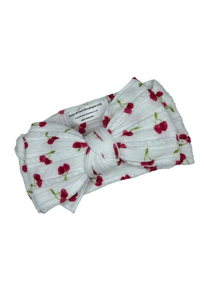 White Cherry Print Larger Bow Headband For Newborns to Age 3 - Image 2