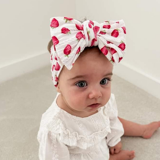 White Strawberry Larger Bow Headband For Newborns to Age 3 - Image 1