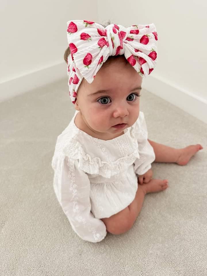 White Strawberry Larger Bow Headband For Newborns to Age 3 - Image 3