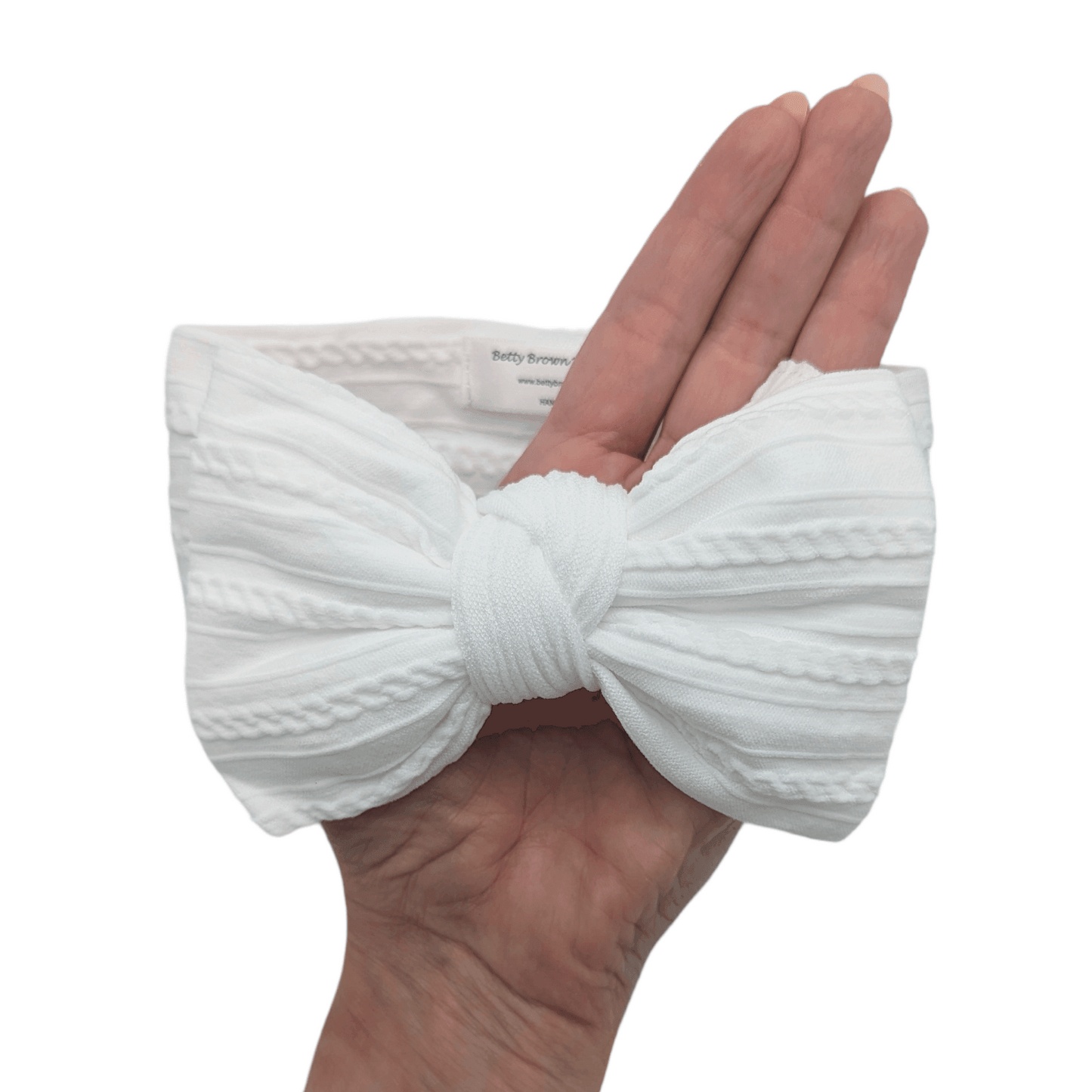 White Larger Bow Headband Designed For Newborn Babies to Age 3 - Image 3